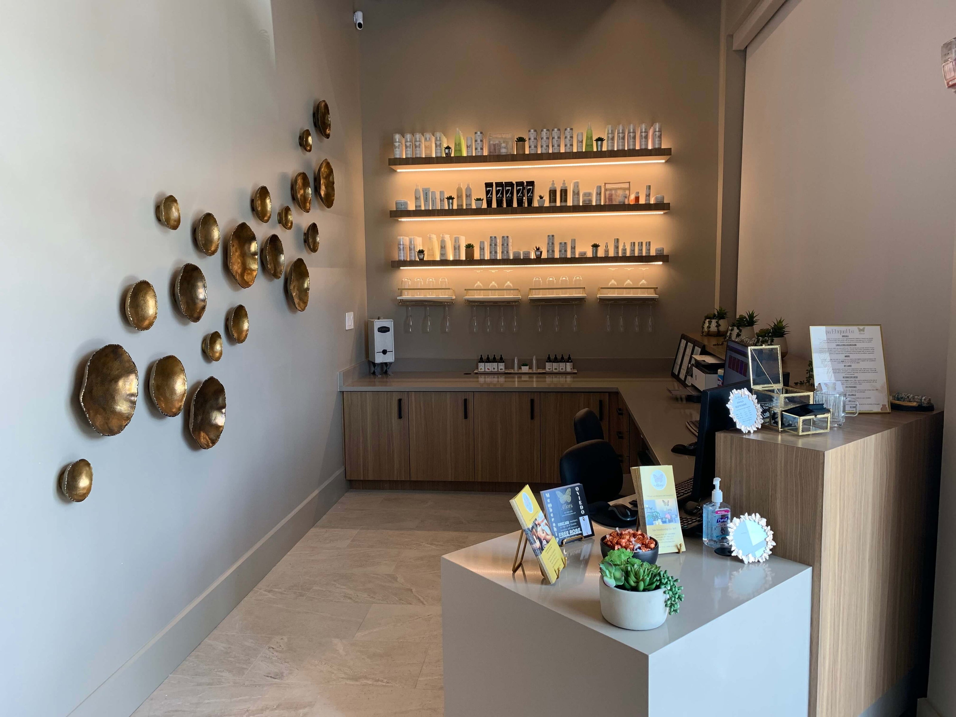 The Oviedo location of Allora Day Spa, featuring a cozy and well-stocked spa reception area.