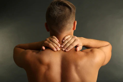 A man receiving a deep tissue massage at Allora Day Spa.