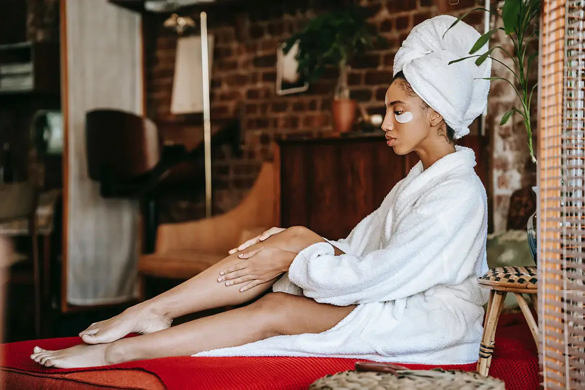 A woman at Allora Day Spa receiving a beauty treatment, including facial care